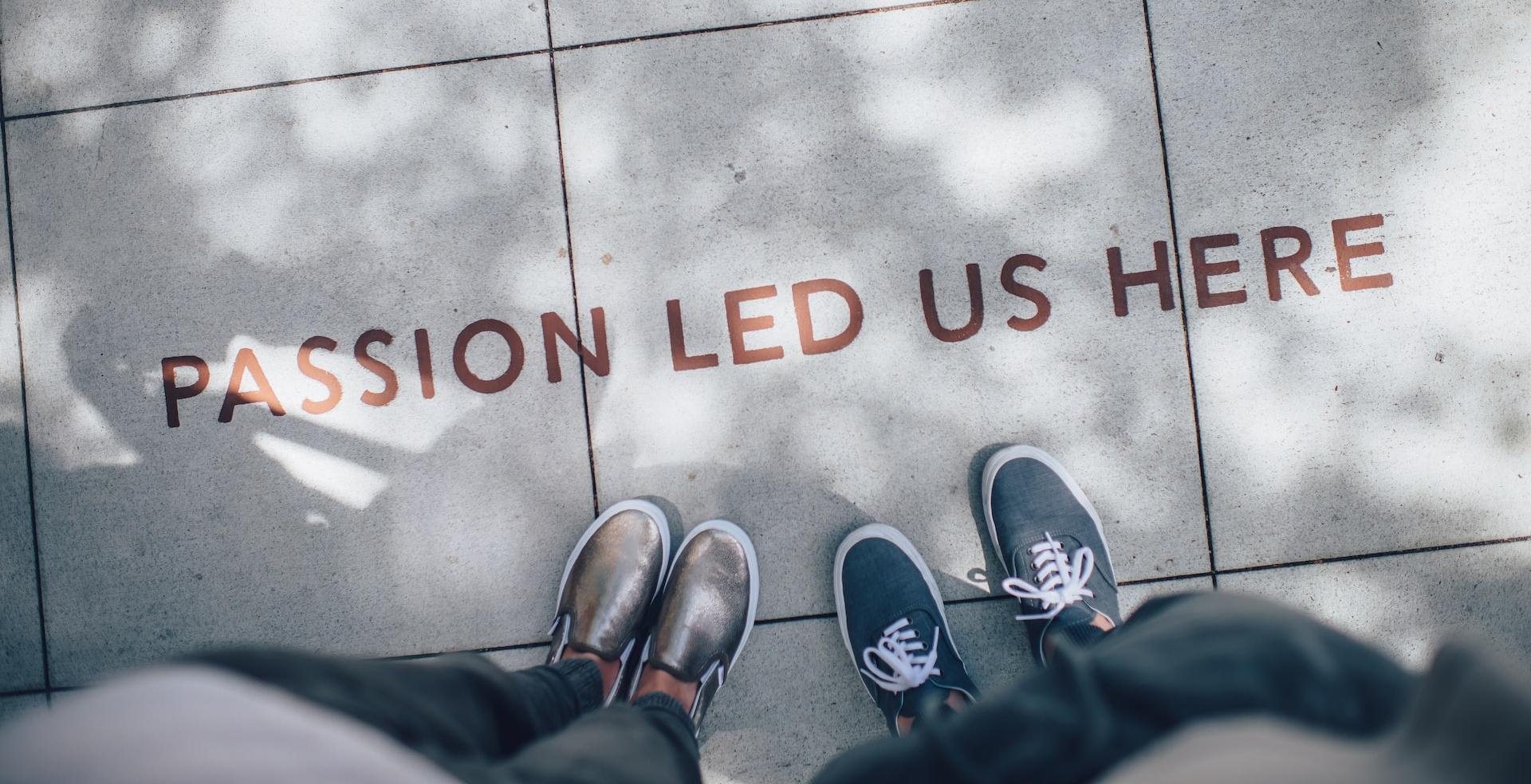 two person standing on gray tile paving