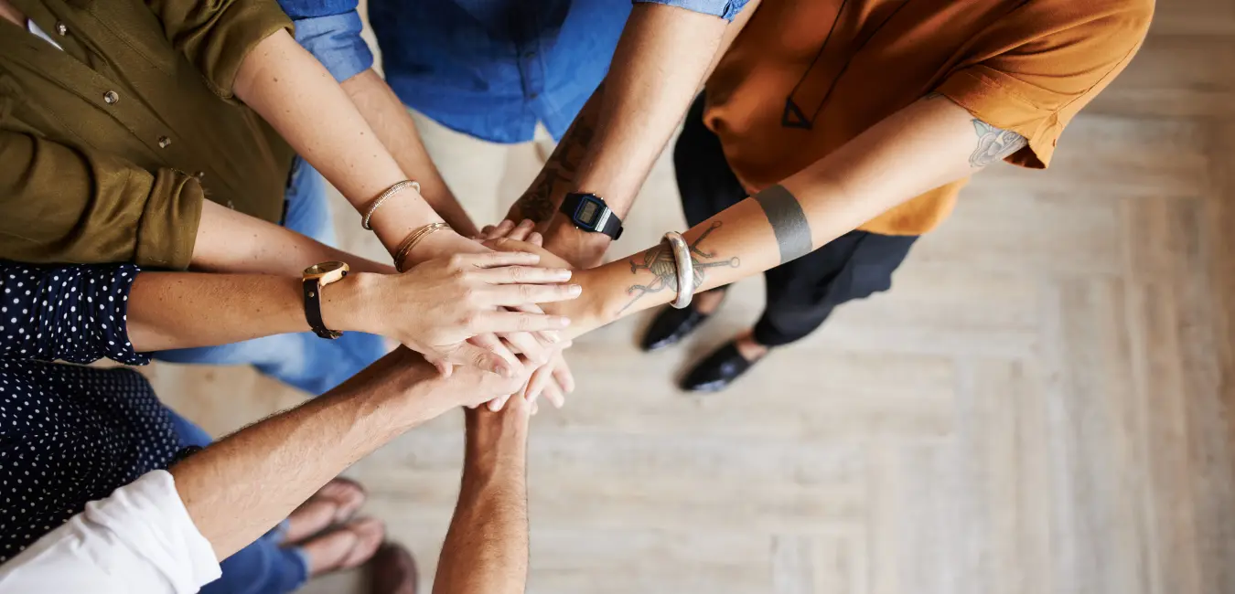 Multiple people's hands in colaboration